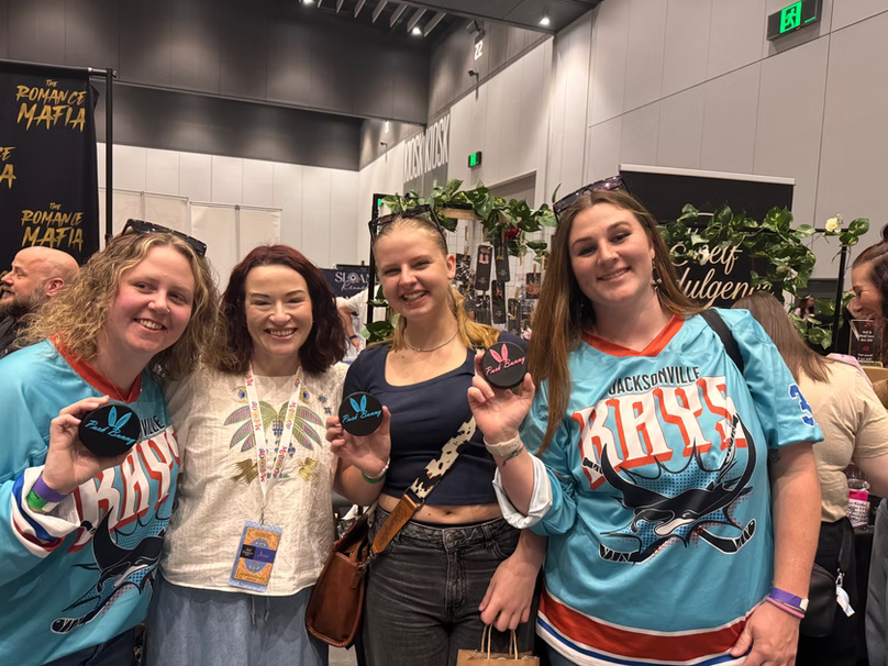 Four smiling people